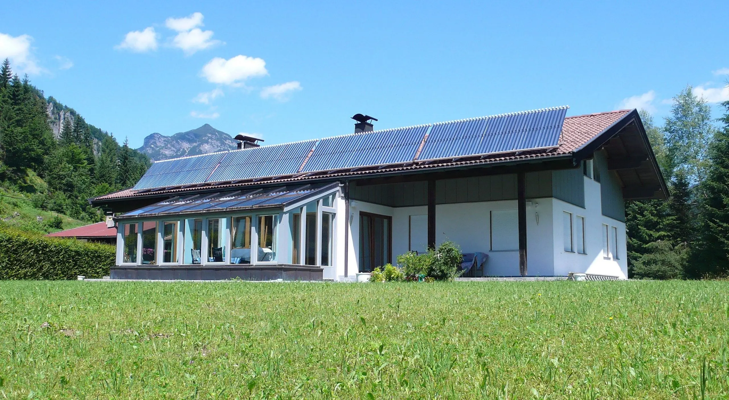 House in the mountains with Consolar collectors on the roof